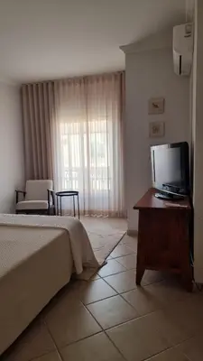 a living room with a couch and a coffee table at Apart T2 praia dos bicos in Albufeira