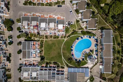an aerial view of a resort with a swimming pool at Windmill by OCvillas in Albufeira