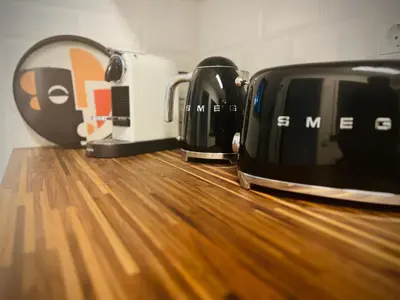 a toaster and toasters sitting on top of a wooden counter at Vilamoura 2 Bedroom with Pool - Na Casa De Pascal in Vilamoura