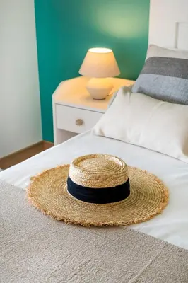 a living room with a white couch and a fireplace at Balaia 3BR Sunny Terrace in Albufeira