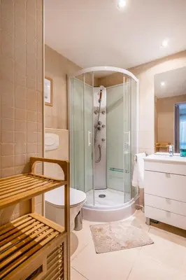 a bathroom with a shower and a toilet and a sink at Balaia 3BR Sunny Terrace in Albufeira