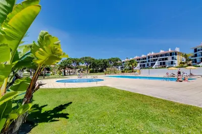 a park with a swimming pool and a building at AL - Apartamento Vila Sol Village in Cabeço de Câmara