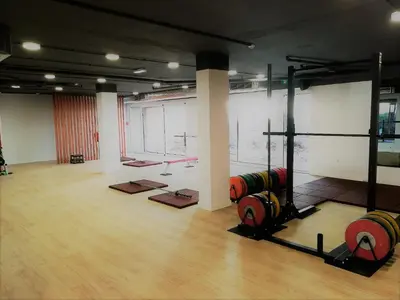 a gym with dumbbells in a large room at Falésia Ocean Villa by The Portuguese Butler in Albufeira