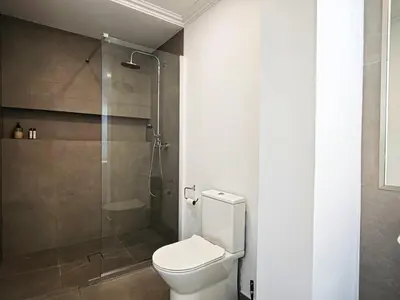 a bathroom with a toilet and a shower at Old Town II Apartment by Stay ici Algarve Holiday Rental in Albufeira