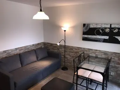 a living room with a couch and a table at ALEXA APARTMENT T2, Albufeira Center two bedrooms Self check-in in Albufeira