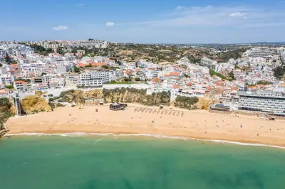 an aerial view of a beach and buildings at Beach Studio in Albufeira's old town in Albufeira