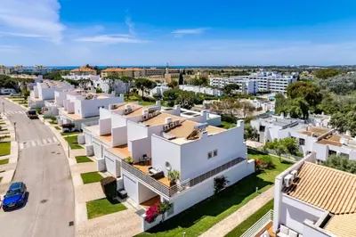 an aerial view of a city with white houses at Luxury Villa in Serene Location with Pool & Private Garden in Quarteira