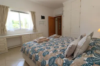 a bedroom with a bed with towels on it at Villa Jóia - 3 Bedroom Villa with Swimming pool in Boliqueime, near Vilamoura, Algarve in Boliqueime