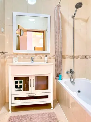 a bathroom with a sink and a tub and a mirror at AlbufeiraOrada Garden by Be Cherish in Albufeira