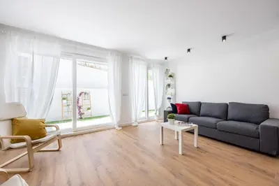 a living room with a couch and a table at Alfamar Inês Apartment in Albufeira