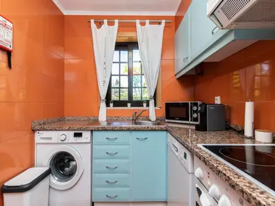 a kitchen with a washing machine and a sink at Akivillas Albufeira Felicity in Albufeira