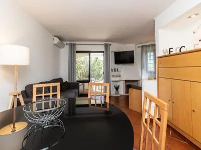 a living room with a couch and a table at Akivillas Albufeira Felicity in Albufeira