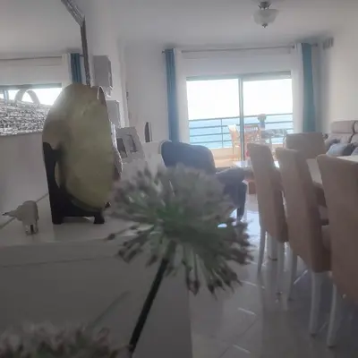 a dining room with a table and chairs and a dining room at Ocean Blue II in Quarteira