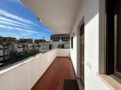 a balcony with a view of a city at Falésia Beach Apartment in Albufeira