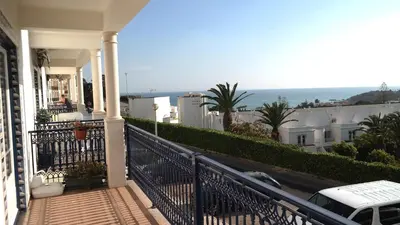 a balcony of a house with a view of the ocean at Bicos Beach Apartments By Albufeira Rental in Albufeira