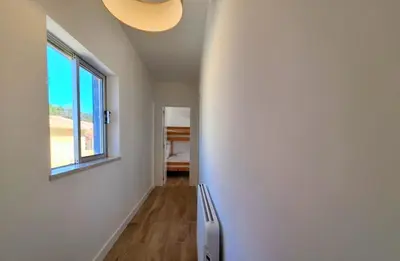 a room with a window and a refrigerator at Vila Arvela in Albufeira