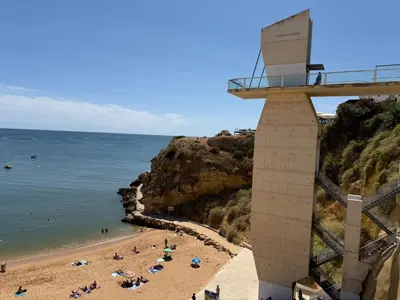 a view of a beach with a lifeguard tower at The Best Downtown Albufeira in Albufeira