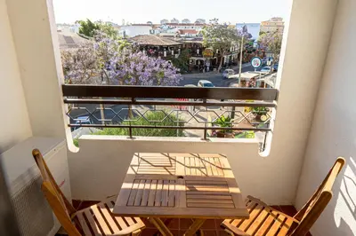 a table and chairs on a balcony with a view at Cozy Albufeira Charm in Albufeira