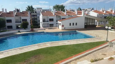 a swimming pool in the yard of a house at Apt-236 in Albufeira