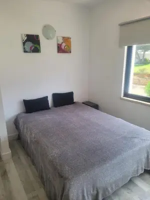 a bedroom with a bed in a room with a window at Apt-236 in Albufeira