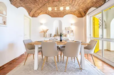 a dining room with a table and chairs at Villa Bougainvilla - Vilamoura - Pool - Free wifi - Air con in Quarteira