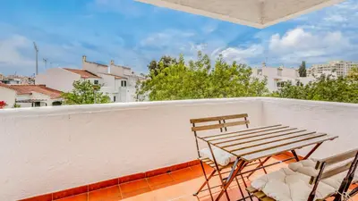 a table and chairs on a balcony with a view at Vilamoura Coastal Retreat by LovelyStay in Vilamoura