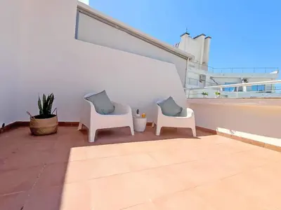 two chairs sitting on top of a balcony at Lovely Terrace Apart. Downtown in Faro