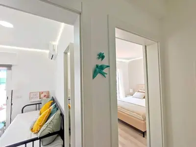 a room with a bedroom with a bed and a mirror at Lovely Terrace Apart. Downtown in Faro