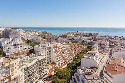 an aerial view of a city with buildings and the ocean at Albufeira, OLD TOWN - VERASOL N in Albufeira