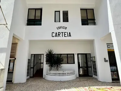 a facade of a building with the name cafeteria at Quarteira Ocean Breeze 1 With Pool by Homing in Quarteira
