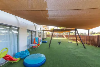 a playground with swings and a play area at Vilamoura Marina Lake in Vilamoura