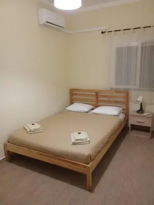 a bedroom with a bed with two towels on it at Apartamento T3 in Faro