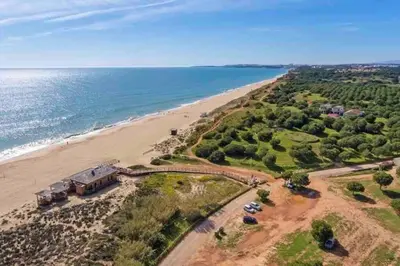 an aerial view of a beach and the ocean at Vilamoura-Praia da Falésia T2 in Quarteira