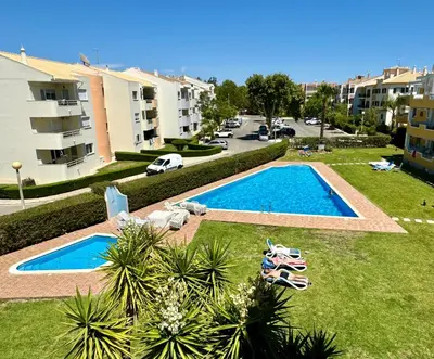 an aerial view of a swimming pool in a resort at Vilamoura-Praia da Falésia T2 in Quarteira