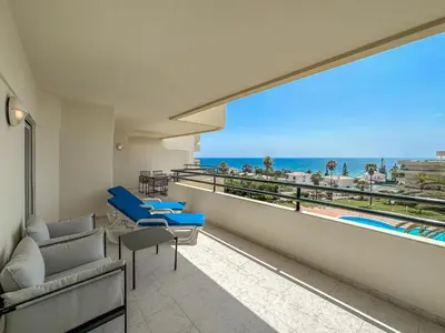 a balcony with a view of the beach and the ocean at Luxury Apart wStunning Sea Views, Walk Beach in Albufeira