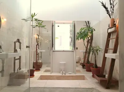 a bathroom with a shower with potted plants in it at Eco-Villa Monte Do Barrocalinho in Loulé