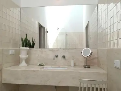 a bathroom with a sink and a mirror at Eco-Villa Monte Do Barrocalinho in Loulé