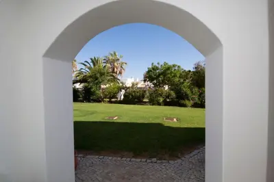 an archway with a view of a park at SÃO RAFAEL BEACH VILLAGE 131 - Apartamento T2 Praia de São Rafael - Albufeira in Albufeira
