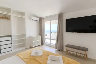a bathroom with a shower with a toilet and a sign that sayshave holidays at #171 Casa do Páteo II Vista Mar by Home Holidays in Albufeira