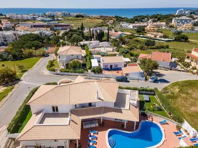 an aerial view of a house with a swimming pool at Villa Cavi in Olhos de Água