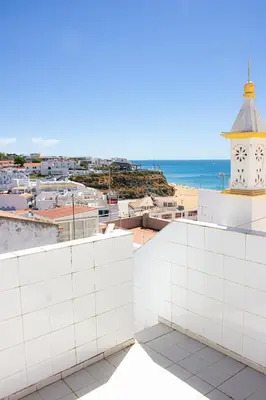 a view of the beach from the roof of a building at Casa Maria in Albufeira