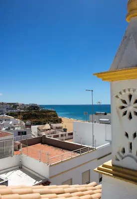 a view of the beach from the roof of a building at Casa Maria in Albufeira