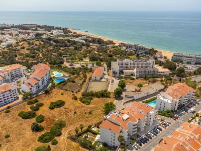 an aerial view of a city with houses and the ocean at Sea View Central Town 2 Bedroom Apartment in Albufeira