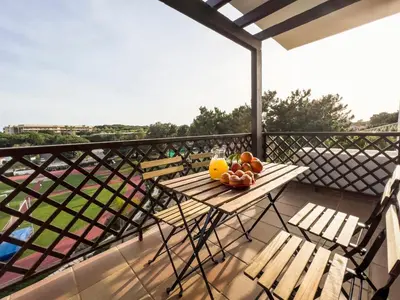 a table with fruit on top of a balcony at Pine Sun Park Т1 apartment Falesia beach in Olhos de Água