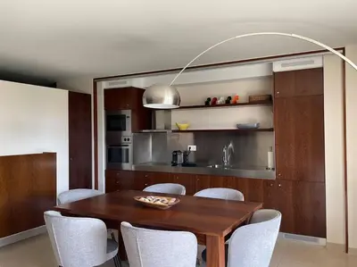 a dining room with a wooden table and chairs at Herdade dos Salgados - 2 Bedroom in Guia