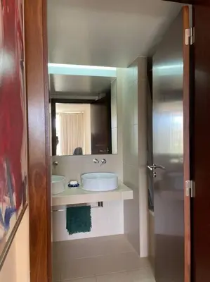 a bathroom with a sink and a mirror at Herdade dos Salgados - 2 Bedroom in Guia