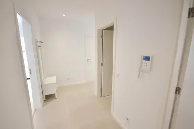 an empty white hallway with a door to a room at Blue Horizons, (AT18) 2 Bedroom, Olhos de Agua in Olhos de Água
