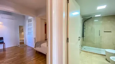 a bathroom with a shower and a glass door at Que sonho! Vista Marina T2 HsR Vilamarina in Vilamoura