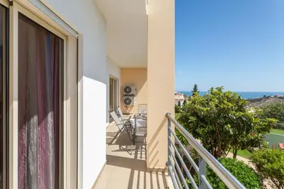 a balcony with a view of the ocean at Encosta da Orada By Albufeira Rental in Albufeira