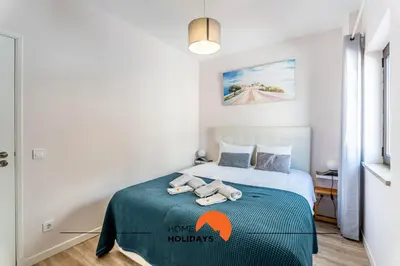 a bedroom with a bed with two towels on it at #164 Saradel 42 by Home Holidays in Albufeira